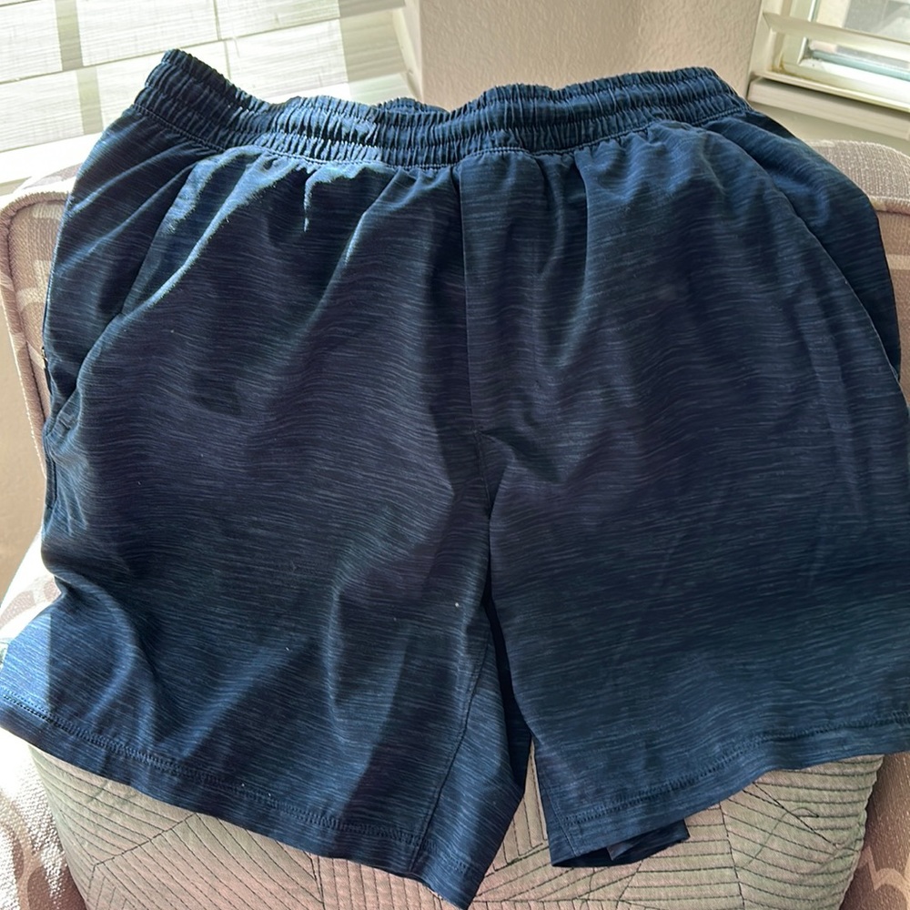 Lululemon Pace Breaker linerless short 7” size small in navy
